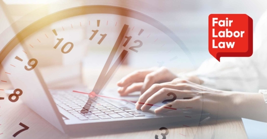 Close up of hands typing on a laptop with a clock overlay