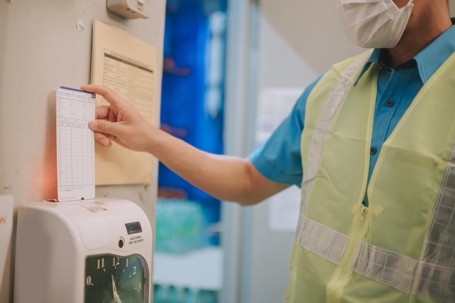 man clocking in at work