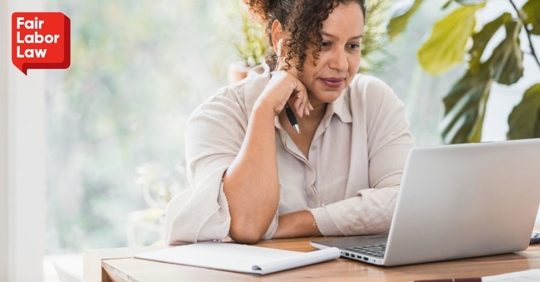 employee looking at laptop