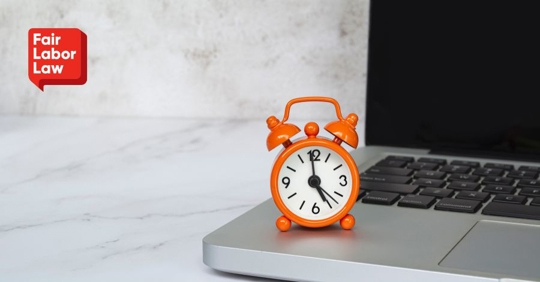 laptop and small clock